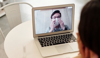 Doctor consulting with a patient over telecon
